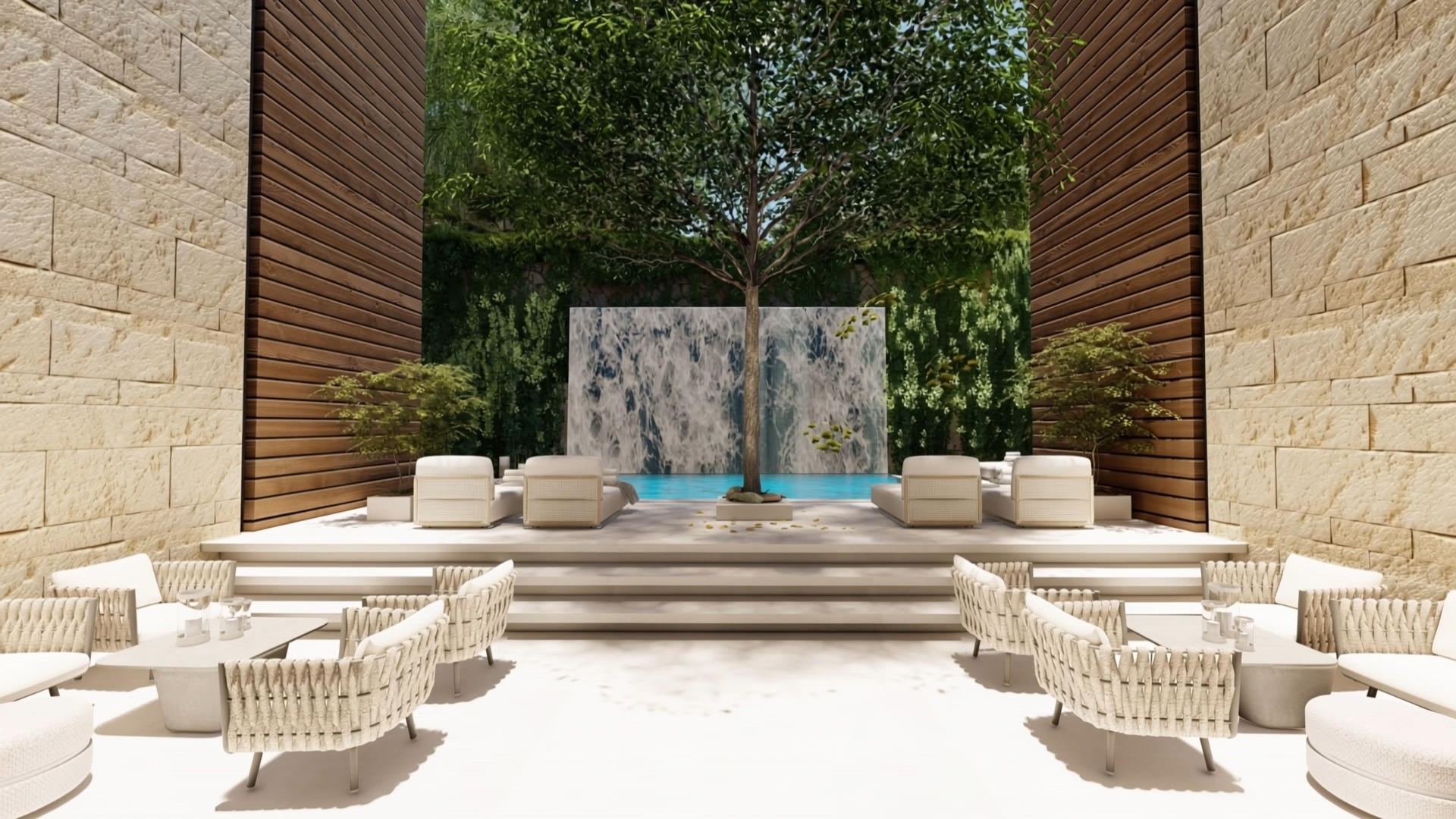 The courtyard at Alpinum: woven lounge chairs and steps up to a tree, a pool and a stone water wall, between sandstone and timber walls